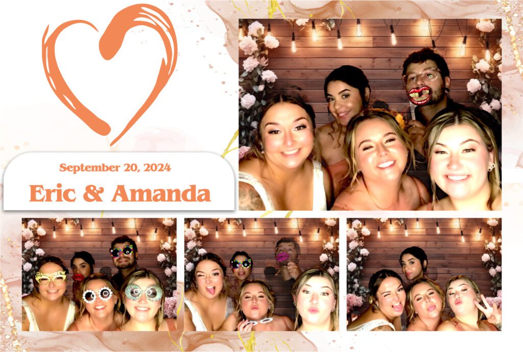 Group photo in a decorated photo booth celebrating Eric and Amanda’s wedding, featuring flower wall backdrop and festive props.