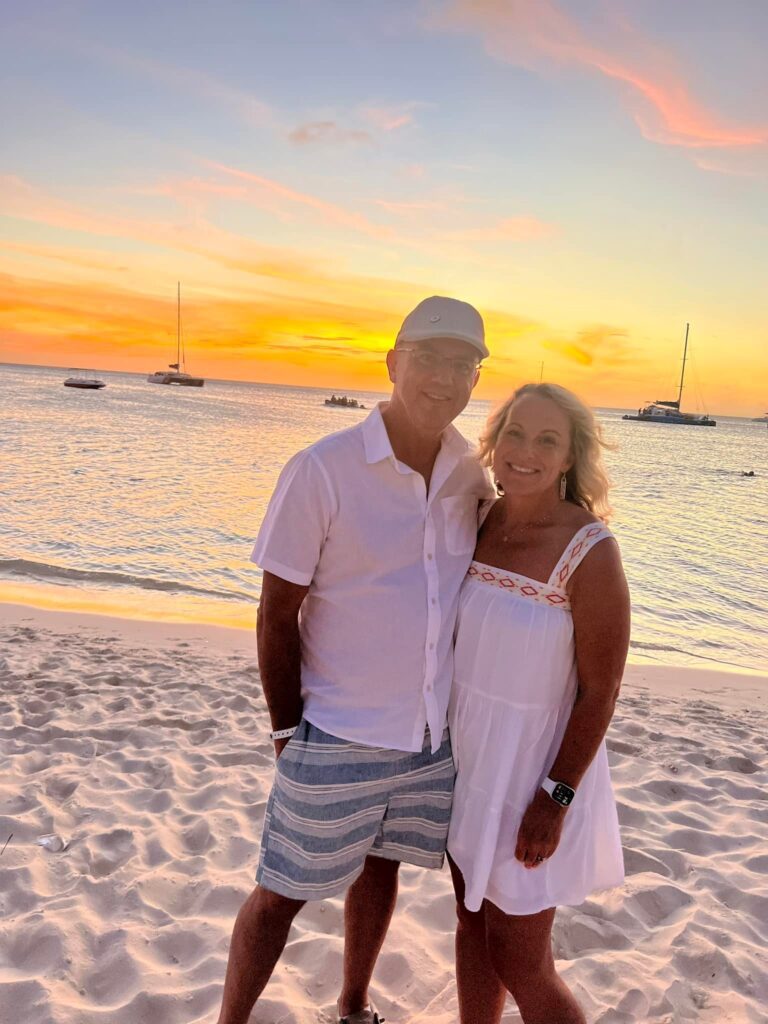 Keith and Angela Fallon on vacation in Aruba at sunset