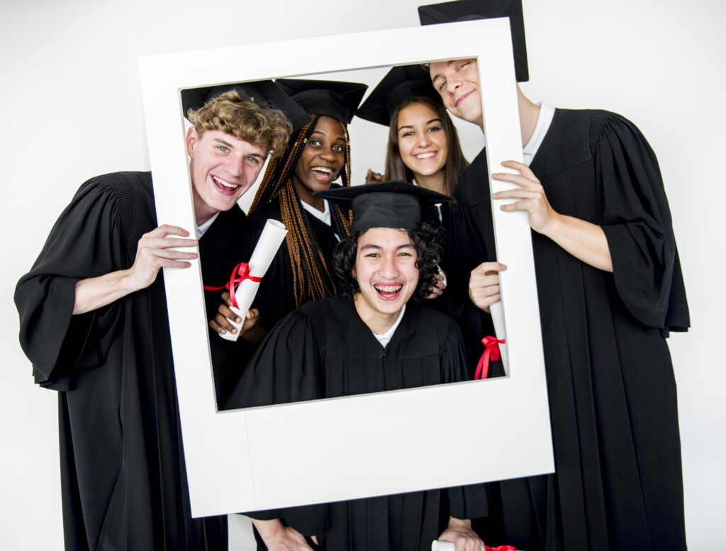 Capture the Moment with a Graduation Photo Booth in MA Graduate celebrating with friends inside a 360 photo booth in Massachusetts